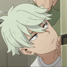 a close up of a person with white hair