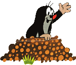 a cartoon mole is standing on a pile of dirt