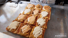 a bunch of sandwiches are sitting on a tray with the words made in animotica on the bottom