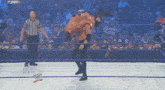 a man in a wrestling ring with the word wwe on the bottom
