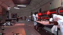 a man in a lab coat is smoking a cigarette in a room with other people