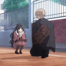 a man kneeling down next to a girl with a brown backpack