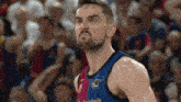a man with a beard is wearing a jersey that says asistencia on it