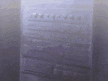 a close up of a person 's hand in front of a stove top oven