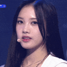 a close up of a woman 's face with a microphone and the word die on the bottom