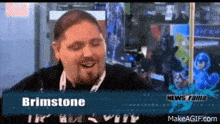 a man with a beard is smiling in a video game advertisement .