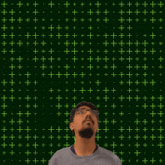 a man is looking up at the number 11 surrounded by yellow stars