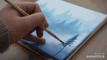 a person is painting a picture on a canvas with the words made in animotica below it