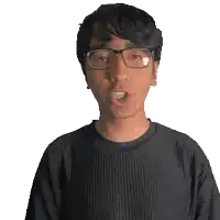a man wearing glasses and a johan shirt
