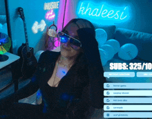 a woman sitting in front of a neon sign that says hustle