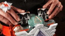 a person is holding a toy with a triangle on it