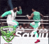 two men are fighting in a wrestling ring with the word safuu on the bottom .
