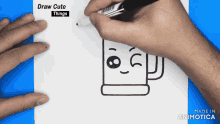 a person is drawing a cup with a face and the words draw cute things above it