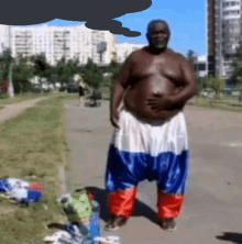a shirtless man wearing a pair of pants that look like a russian flag