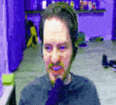a man with a beard wearing headphones and a tie