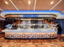 a market deli on a cruise ship has a wooden floor