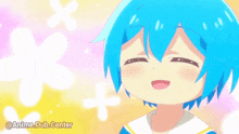 a girl with blue hair is smiling with her eyes closed .