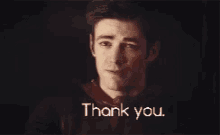 a man says thank you in a dark room