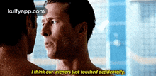 two men are looking at each other and one of them is saying i think our wieners just touched accidentally