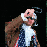a man wearing an american flag scarf holds a magnifying glass over his head
