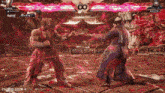 two men are fighting in a video game and one of them is wearing a red shirt .