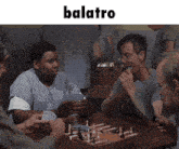 a group of people are playing a game of chess and the word balatro is above them