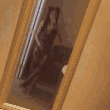 a woman is taking a selfie in a mirror