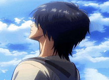 a man with a backpack looks up at the sky