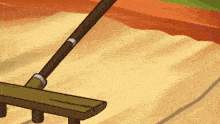 a cartoon drawing of a rake laying on a pile of sand