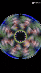 a colorful circle with a black center and the words capcut below it