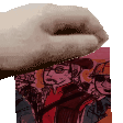 a close up of a person 's hand holding a piece of paper in front of a picture of a group of people .