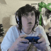 a woman wearing headphones is holding a video game controller .