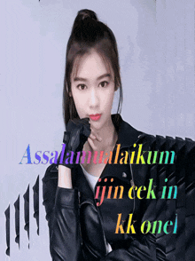 a woman wearing a leather jacket and gloves with the words assalamualaikum in the background