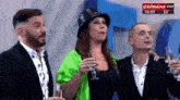 a group of people standing next to each other with cronica vivo written on the bottom right