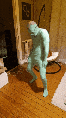 a man in a green suit is standing on a wooden floor