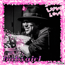a picture of a man in a hat with a pink frame that says " baby girl "