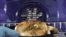 a chicken is being cooked in an oven with the words made in animatica below it
