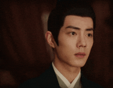 a close up of a man 's face with a very serious look on his face