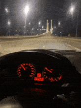 a car 's dashboard shows that it is currently driving at a speed of 220 mph