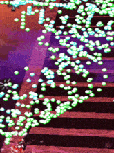a purple background with a bunch of green circles on it