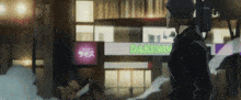 a man is standing in front of a building with a sign that says dakemo