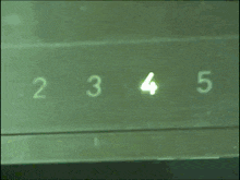 three men are standing in an elevator and one of them has a name tag that says ' chris '