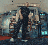 a woman in pajamas is dancing in a room