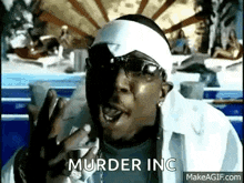 a man wearing sunglasses and a headband is making a funny face and says `` murder inc '' .