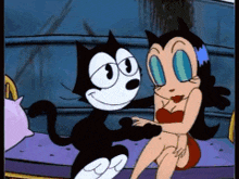 felix the cat and a woman are sitting on a couch
