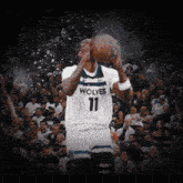 a basketball player wearing a jersey that says wolves 11