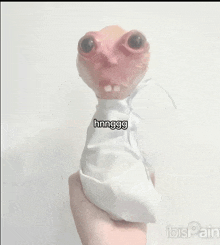 a person is holding a stuffed animal that says hmnggg