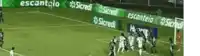 a group of soccer players on a field with a banner that says sicredi