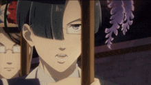 a boy with glasses is holding a wooden stick