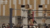 two women in a wrestling ring with a sign that says stardom on it